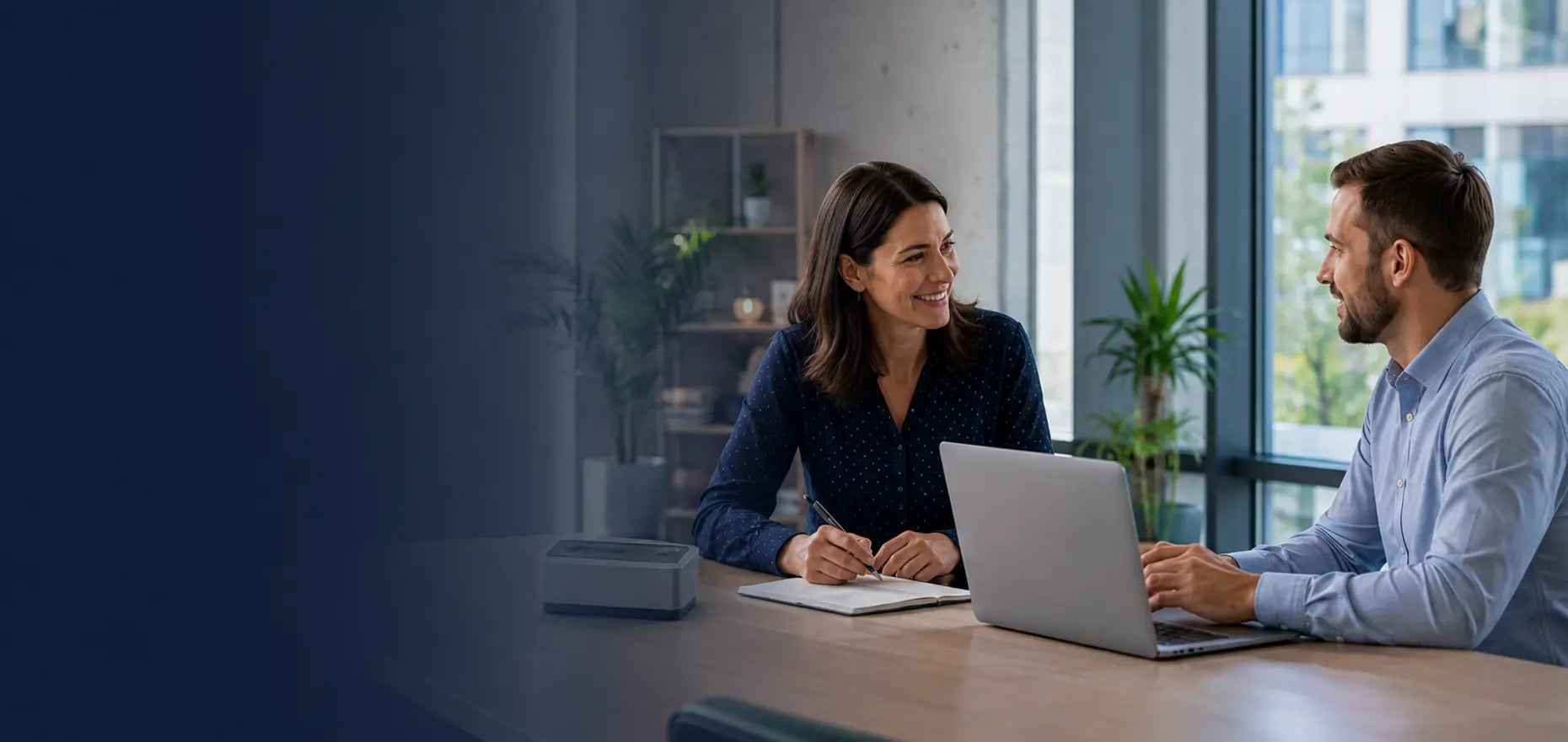 A Cybist business adviser discussing an account application with a customer